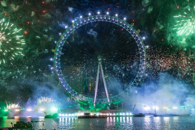 LONDON, UNITED KINGDOM - JANUARY 1: Fireworks light up the London sky over the London Eye on the River Thames to celebrate the new year in United Kingdom on January 1, 2024. (Photo by Ray Tang/Anadolu via Getty Images)