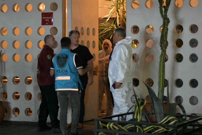 Forensic workers and police officers work at the hotel where British singer Liam Payne died in Buenos Aires