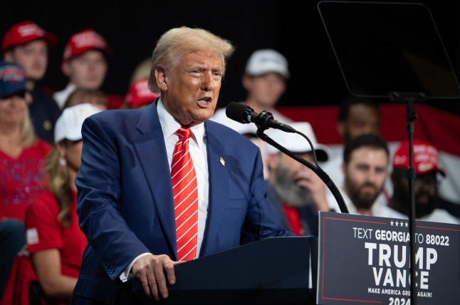 Mandatory Credit: Photo by Robin Rayne/ZUMA Press Wire/Shutterstock (14787526q) Donald Trump speaks at rally at Cobb Energy Performing Arts Center north of Atlanta on first day of early voting in this swing state. Donald Trump at Georgia rally, Marietta, USA - 15 Oct 2024