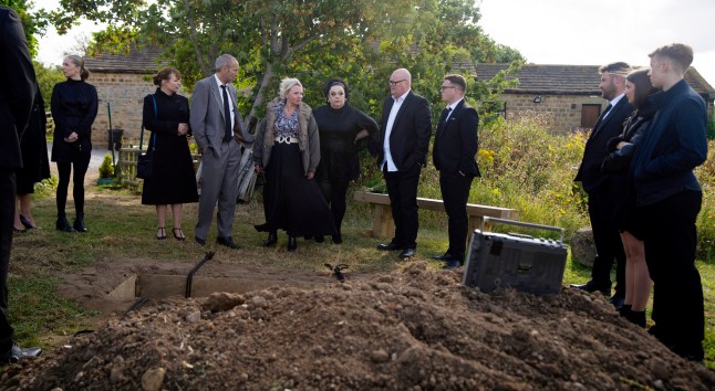 The Dingles, and Tina Dingle, gather around Zak's grave in Emmerdale