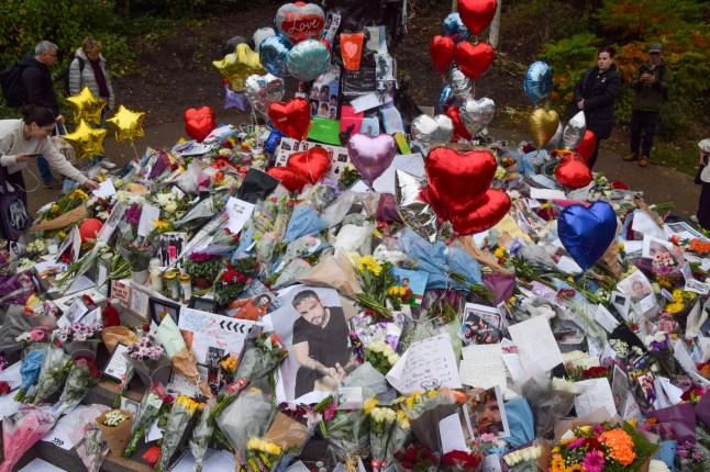 Mandatory Credit: Photo by Vuk Valcic/ZUMA Press Wire/Shutterstock (14801607f) Fans continue to leave flowers and tributes at a memorial for pop star Liam Payne at the Peter Pan statue in Hyde Park, London. The One Direction singer died after falling from a hotel balcony in Buenos Aires. Liam Payne memorial in Hyde Park, London, England, Uk - 21 Oct 2024