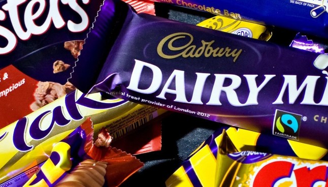 A variety of Cadbury's chocolate products are pictured in London, on January 19, 2010. British confectioner Cadbury said Tuesday it had agreed to a takeover from US giant Kraft worth 11.5 billion pounds, creating a world leader in food and confectionery. The pair announced in a statement that Cadbury management had agreed to a takeover worth 840 pence per share -- valuing the group at the equivalent of 13.1 billion euros or 18.9 billion dollars. AFP PHOTO/Leon Neal (Photo credit should read LEON NEAL/AFP via Getty Images)