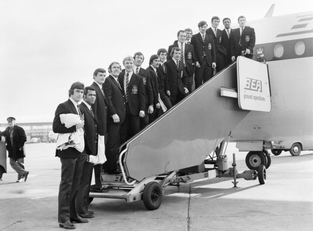 The Great Britain Rugby Team standing on the steps leading onto a plane at Manchester Airport – on their way to Paris to compete in The Rugby World Cup. Picture taken 28th October 1972 (Photo by Brenards/Mirrorpix via Getty Images)