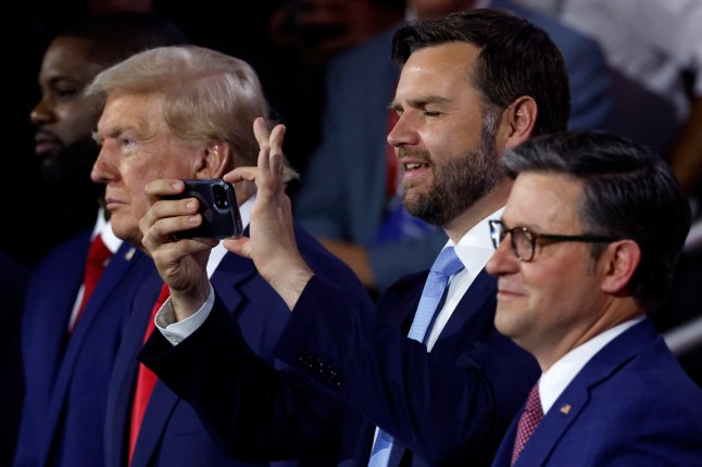 MILWAUKEE, WISCONSIN - JULY 15: Republican vice presidential candidate, U.S. Sen. J.D. Vance (R-OH) takes photographs using his phone during the second day of the Republican National Convention at the Fiserv Forum on July 16, 2024 in Milwaukee, Wisconsin. Delegates, politicians, and the Republican faithful are in Milwaukee for the annual convention, concluding with former President Donald Trump accepting his party's presidential nomination. The RNC takes place from July 15-18. (Photo by Chip Somodevilla/Getty Images)