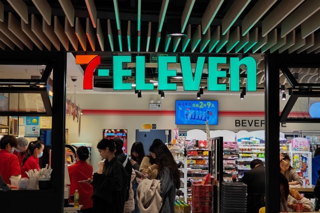 SHANGHAI, CHINA - MARCH 15, 2024 - Customers shop at a 7-Eleven convenience store at a shopping mall in Pudong New Area in Shanghai, China, March 15, 2024. (Photo credit should read CFOTO/Future Publishing via Getty Images)