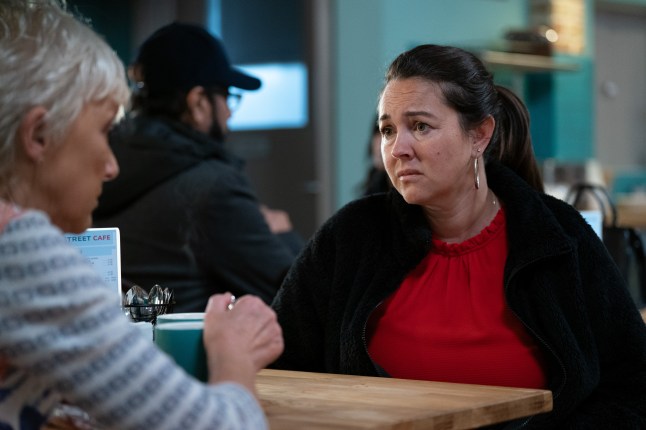 Stacey is concerned as she looks at Jean across the table in the café in EastEnders