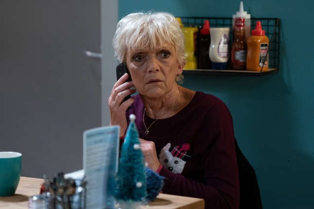 Jean looking worried on the phone in EastEnders