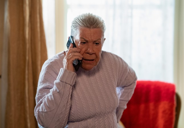 Mo Harris on the phone in EastEnders