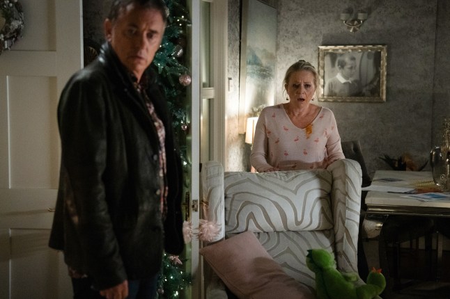 Alfie and Linda in Sharon's living room in EastEnders