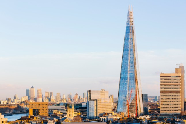 London cityscape with Canary Wharf financial district and The Shard skyscraper, England, UK