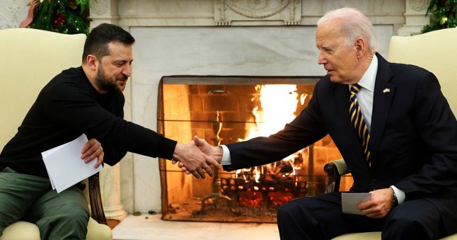 US President Joe Biden and Ukraine's president Volodymyr Zelenskyy shaking hands.