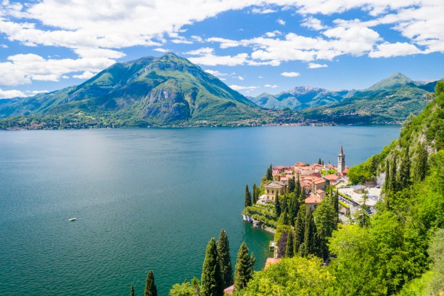 Village of Varenna on shore of Lake Como with Menaggio and Monte Crocione on opposite coastline, Lecco province, Lombardy, Italy