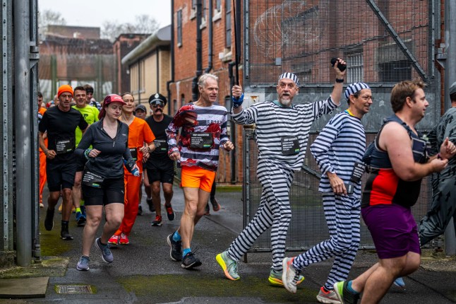 BNPS.co.uk (01202 558833) Pic: MaxWillcock/BNPS Running with conviction... These runners escaped to victory as they completed 26.2 miles in the UK's only marathon inside a prison. There were 135 die hard marathon fans taking on the gruelling challenge - completing 55 laps around the corridors, gangways and prison yard at the Victorian former jail in Dorchester, Dorset. Some got into the spirit by dressing as inmates or police officers.