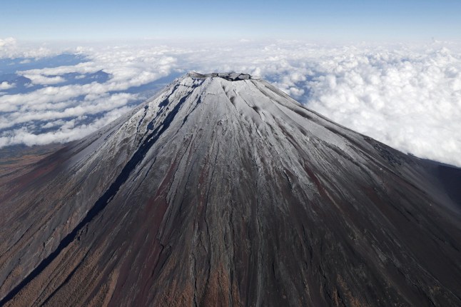 Top of Mt.Fuji is covered by snow in this photo taken by Kyodo, Japan, November 6, 2024. Mandatory credit Kyodo/via REUTERS ATTENTION EDITORS - THIS IMAGE HAS BEEN SUPPLIED BY A THIRD PARTY. MANDATORY CREDIT. JAPAN OUT. NO COMMERCIAL OR EDITORIAL SALES IN JAPAN.