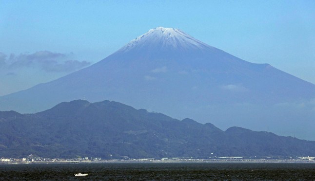 Mt. Fuji is snowcapped, seen from Shizuoka prefecture, central Japan Wednesday, Nov. 6, 2024. (Kyodo News via AP)