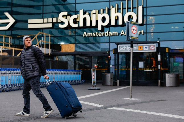 A person walks at Amsterdam Airport Schiphol, after Israel announced they are sending two planes to bring back fans of an Israeli soccer team from the Netherlands following the violence targeting them, in Amsterdam, Netherlands, November 8, 2024. REUTERS/Piroschka Van De Wouw