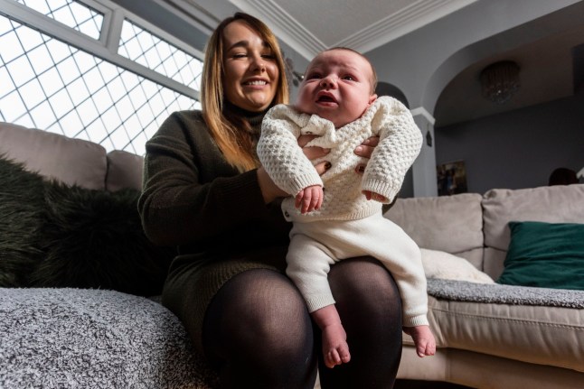 Nicole Taylor gave birth to her second son, George, who weighed a massive 11lbs 7oz. Nicole Taylor - who is just 5'2" and a size 10-12, says her second son George stunned surgeons when he was delivered by c-section on October 17, pictured at the family home in West Yorks, November 7, 2024. Release date ??? November 10, 2024. A mum was stunned after giving birth to a baby boy that weighed a whopping 11lbs 7oz. Nicole Taylor - who is just 5'2" and a size 10-12 - says her second son George stunned surgeons when he was delivered by c-section on October 17. The average weight of a newborn baby boy in the UK is 7lbs 8oz, meaning George was almost 50% heavier than the average newborn. She and husband 6'1" Tommy, 33, had to remove the newborn attachment from their car seat to get George home from Leeds General Infirmary as it was too small for him. And he was instantly in size two nappies and 0-3 month clothes as none of his newborn clothes would fit him.