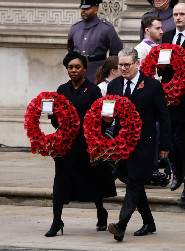 Leader of the opposition Kemi Badenoch and Prime Minister Sir Keir Starmer carry wreaths during the Remembrance Sunday service at the Cenotaph in London. Picture date: Sunday November 10, 2024. PA Photo. See PA story ROYAL Remembrance. Photo credit should read: Jordan Pettitt/PA Wire