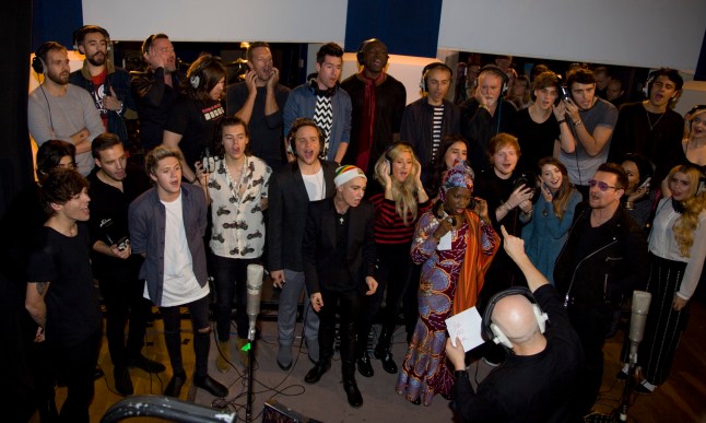 Undated handout photo issued by Band Aid of artists including Niall Horan, Harry Styles, Olly Murs, Sinead O'Connor, Midge Ure, Ellie Goulding, Zoella Sugg, Guy Garvey, Chris Martin, Seal, Roger Taylor, Bono, Paloma Faith, Alfie Deyes, Angelique Kidjo and others during a recording of Band Aid single, Do They Know It's Christmas in 2014. A new 40th anniversary mix of Band Aid's Do They Know It's Christmas? will see the young and old voices of the charity single's artists come together to create an "ultimate" version. Issue date: Wednesday November 13, 2024. PA Photo. Do They Know It's Christmas? - 2024 Ultimate Mix will premiere on UK breakfast radio and streaming on November 25, the 40th anniversary of the recording of the original song, and will be released physically on the Band Aid Compilation on November 29 on CD and vinyl. The new version of the song will feature voices from three previous editions of the song, Band Aid (1984), Band Aid 20 (2004) and Band Aid 30 (2014), including Harry Styles, George Michael and Chris Martin, and will see young and old voices of the likes of Bono singing together. See PA story SHOWBIZ BandAid . Photo credit should read: Band Aid/PA Wire NOTE TO EDITORS: This handout photo may only be used in for editorial reporting purposes for the contemporaneous illustration of events, things or the people in the image or facts mentioned in the caption. Reuse of the picture may require further permission from the copyright holder.