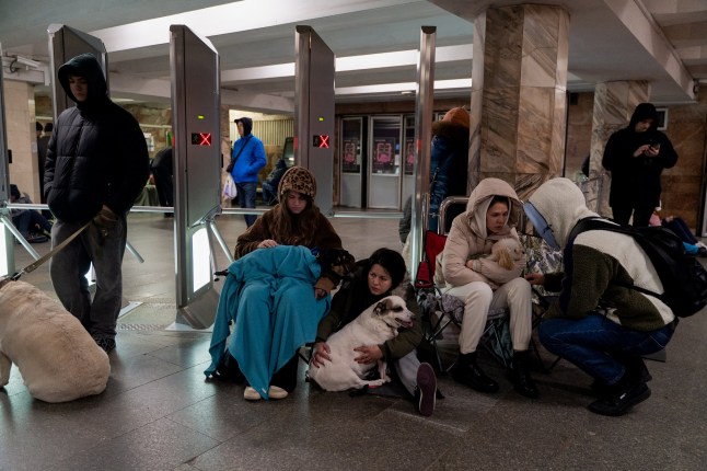 Kyiv residents sit in a subway shelter in the Ukrainian capital on November 17 amid Russian air strikes.