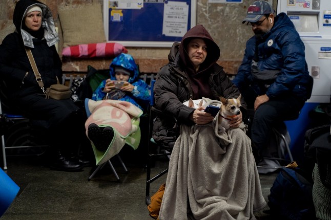 Kyiv residents sit in a subway shelter in the Ukrainian capital on November 17 amid Russian air strikes.