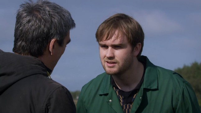 Tom argues with Cain on the farm in Emmerdale