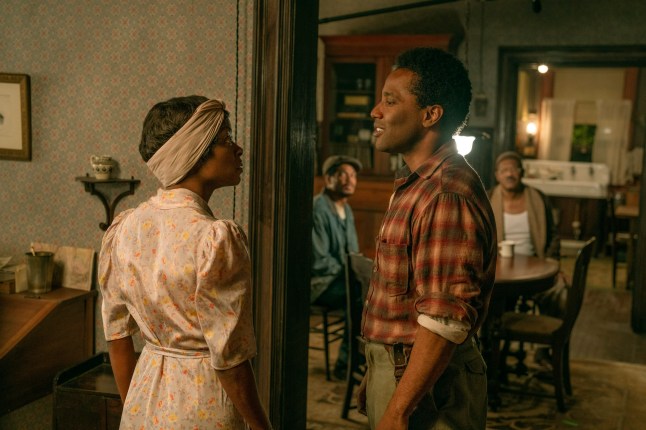 Danielle Deadwyler, left, and John David Washington (right) in The Piano Lesson dressed in period specific clothing, looking at one another