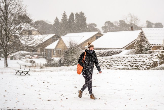 A woman in snowy conditions, in the village of Goathland, North York Moors National Park. There is widespread travel disruption after heavy snowfall and ice affected parts of the UK, with the Met Office advising vehicles could be stranded, power cuts may occur and rural areas could be cut off. Picture date: Wednesday November 20, 2024. PA Photo. Photo credit should read: Danny Lawson/PA Wire