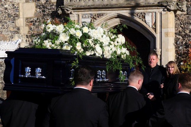 Karen and Geoff Payne, parents of former One Direction singer Liam Payne, react as their son's coffin arrives for the funeral at St. Mary's Church in Amersham, near London, Britain, November 20, 2024. REUTERS/Toby Melville