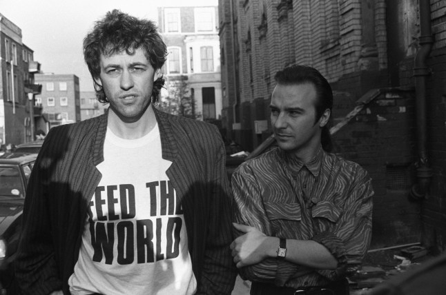 Bob Geldof and Midge Ure pictured outside SARM Studios in Notting Hill, London, during the recording of the Band Aid single 'Do They Know It's Christmas?', part of the Feed The World campaign, raising money for famine-stricken Ethiopia, on November 25, 1984. (Photo by Larry Ellis/Express Newspapers/Getty Images)