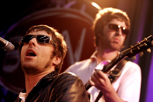 Liam GALLAGHER and Noel GALLAGHER of Oasis perform on stage