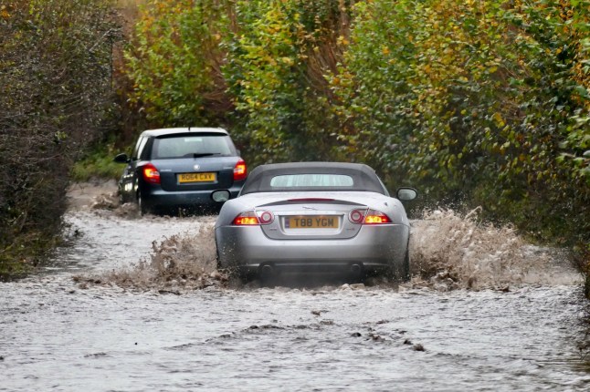 Mandatory Credit: Photo by Geoffrey Swaine/Shutterstock (14947195j) Vehicles make their way through the flood waters along the country lanes. Seasonal weather, Storm aftermath, flooding, Dunsden, Oxfordshire, UK - 27 Nov 2024