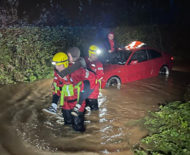 Story from Jam Press (Car Roof Proposal) Pictured: Ashley Stevens and Davie Woodley-Kingston being rescued from the floods. Dried and groom! Besotted boyfriend proposes to girlfriend while stuck on roof car during flood A besotted boyfriend popped the question to his girlfriend while the couple were stuck on the roof of a flood-hit car. Ashley Stevens, 22, and Davie Woodley-Kingston, 24, were celebrating their first anniversary when their motor got swamped. The pair took to the roof of their car and phoned for help. But Davie, who had been planning to propose, was swept away with emotion and proposed there and then. The pair had been on a romantic night away in Chard, Somerset, and were heading to nearby Taunton for a Nando's. But their BMW started to fill with water near Taunton racecourse on Sunday (Nov 24) during Storm Bert. Davie was forced to climb onto the car roof before pulling Ashley up to safety. And as they were shivering in the darkness waiting for rescue, Davie did the deed. "I was going to propose in our Airbnb cabin later that evening,??? the health and safety advisor at Southampton Docks told??What's The Jam. "But when the car got flooded it went so far off the plan. "It was such a turn of events. "I thought to myself that it would be memorable and so I just went for it." Rescuers from Taunton fire station arrived after about half an hour and pulled the couple from Southampton, Hants, to safety. The firefighters were able to get the BMW out of the water and, incredibly, it started first time. Davie proposed again properly later that evening and gave Ashley her engagement ring which he???d been keeping at the Airbnb. The flowers he bought for the occasion also survived, despite being in the car boot. He added: "The fire brigade was fantastic - a real bunch of top class gentlemen. "After the most beautiful and eventful weekend I couldn???t be happier. "I???m so happy to be embarking on the next chapter of our lives with Ashley. "T