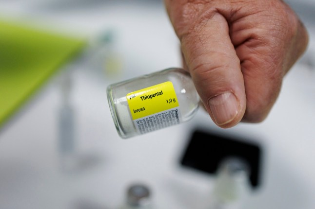 A doctor holds a flask of "Thiopental" a barbiturate that is used in the practice of euthanasia, in a hospital in Belgium, on February 1, 2024. In 2022, 2,966 people underwent euthanasia in Belgium, according to the federal oversight commission. Of that total, 53 were resident in France (Photo by Simon Wohlfahrt / AFP) (Photo by SIMON WOHLFAHRT/AFP via Getty Images)