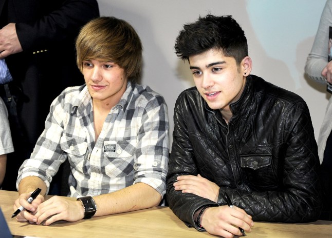 (EXCLUSIVE COVERAGE) (EXCLUSIVE COVERAGE) Zayn Malik and Liam Payne of one Direction sign their new book 'One Direction: Forever Young: Our Official X-Factor Story' at HMV on March 7, 2011 in Manchester, England. ***Exclusive*** (Photo by Shirlaine Forrest/WireImage)