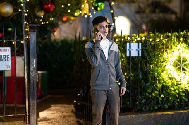 Nugget on the phone in the Square in EastEnders