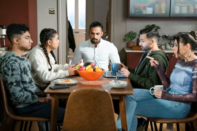 Nugget, Avani, Ravi, Vinny and Priya looking solemn sat around their dining table in EastEnders