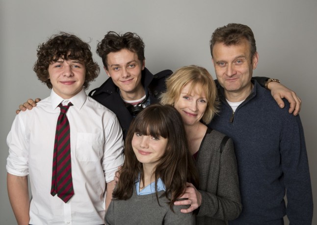 The Outnumbered cast posing with their arms around each other