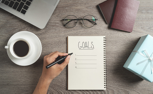 Top view of Man hand is planning and writing to do list