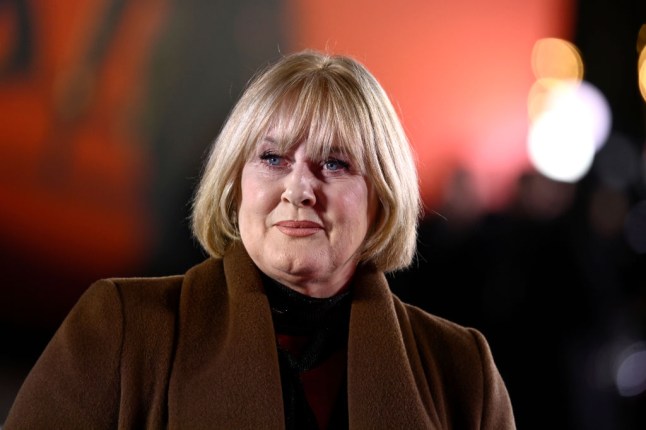 Sarah Lancashire at the Black Doves premiere, wearing a brown coat and black top