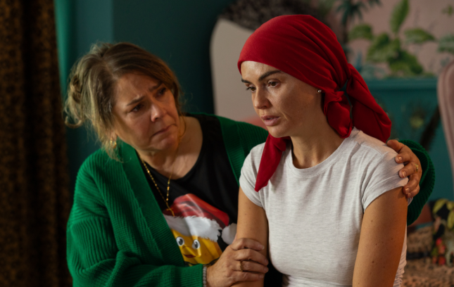 Myra puts her arm around Mercedes in Hollyoaks