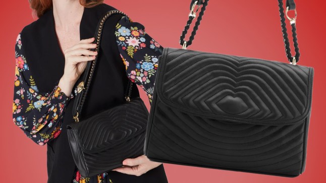 Image of model holding Lulu Guinness Black Lip Ripple Quilted Leather Brooke Crossbody Bag on a red background