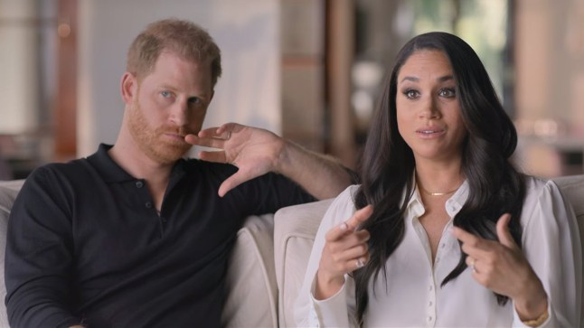 Harry & Meghan sat on a sofa speaking to the camera in their Netflix documentary