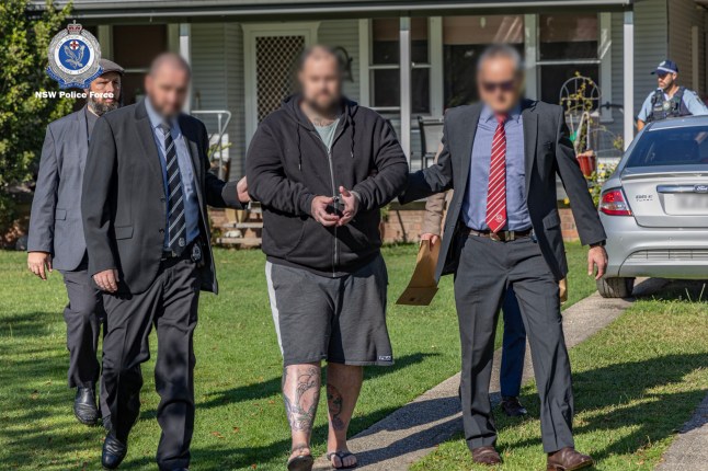 A supplied image shows NSW Police arresting a 37-year-old man in Bowraville, NSW, Thursday, June 8 2023. A 37-year-old man has been arrested over the death of a baby in the state???s central west in 2018. (AAP Image/Supplied by NSW Police) NO ARCHIVING, EDITORIAL USE ONLY 12825425