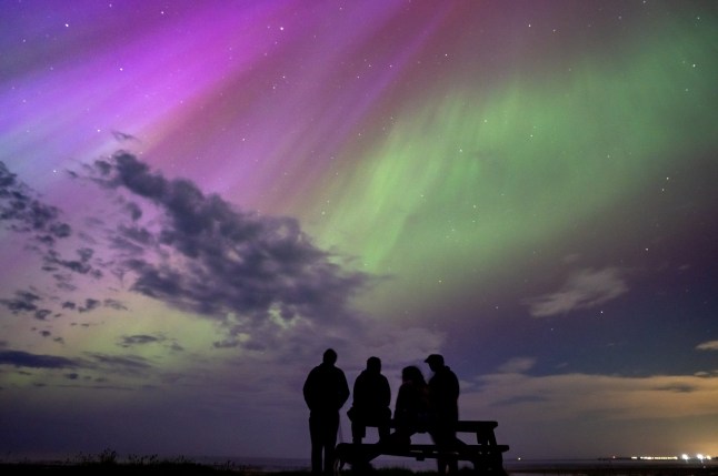 Dated: 11/05/2024 A spectacular show of colour fills the night skies as the Northern Lights aurora borealis wow spectators in Alnmouth, Northumberland.