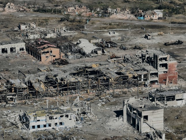 VOVCHANSK, UKRAINE - OCTOBER 2: (EDITOR'S NOTE: No new use of feed image after November 1, 2024. After that date, image will need to be licensed from the website.) An aerial view shows the destroyed city of Vovchansk in the Kharkiv Region near the border with Russia, on October 2, 2024 in Vovchansk, Ukraine. Russian artillery and aircraft have buildings used by soldiers of the Armed Forces of Ukraine. In September, Ukrainian forces recaptured the Volchansky chemical plant in Vovchansk, Kharkiv Oblast, a strategic location previously used by Russian troops for tactical operations along the Vovcha River. (Photo by Libkos/Getty Images)