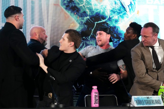 Tommy Fury (left) and Darren Till (centre) are held apart by security during a press conference at Leonardo London. Picture date: Tuesday November 19, 2024. PA Photo. See PA story BOXING London. Photo credit should read: John Walton/PA Wire. RESTRICTIONS: Use subject to restrictions. Editorial use only, no commercial use without prior consent from rights holder.