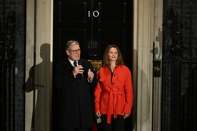 LONDON, ENGLAND - DECEMBER 2: Britain's Prime Minister Keir Starmer and his wife Victoria Starmer attend the official lighting of the Christmas tree outside No.10 Downing Street on December 2, 2024 in London, England. The Prime Minister and Mrs Starmer were joined by NHS workers, military families and members of the police to switch on the Downing Street Christmas lights. (Photo by Leon Neal/Getty Images)