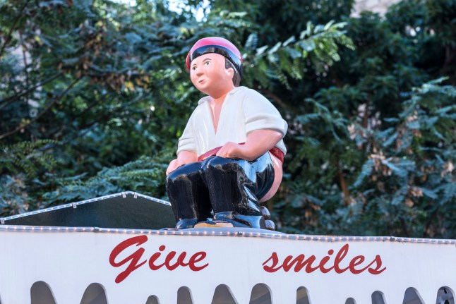 Barcelona, Spain - December 19, 2014: Santa Llucia Fair is a Christmas market items where a significant figure is the Caganer, typical figure Catalan manger. This figure represents someone defecating, now you also put faces of famous people.