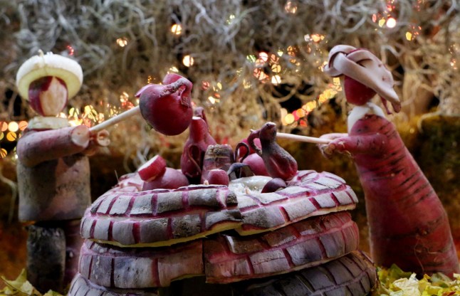 Carved radishes are displayed during the celebration of the "Night of the Radishes" in Oaxaca, Mexico on December 23, 2016. The Night of the Radishes is an annual carving event that has its origins in the colonial period when radishes were introduced by the Spanish. Farmers began carving radishes into figures as a way to attract customers' attention during the Christmas season. (Photo by PATRICIA CASTELLANOS / AFP) (Photo by PATRICIA CASTELLANOS/AFP via Getty Images)